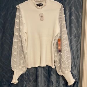 Stylish white sweater.